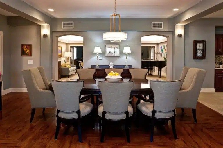 A dining room with a large table and chairs at The Piper, Kansas City, KS.